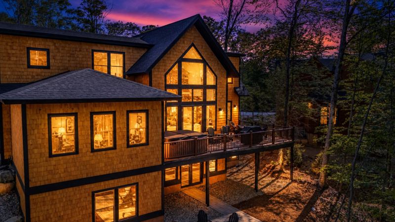 Exterior at dusk with lit windows
