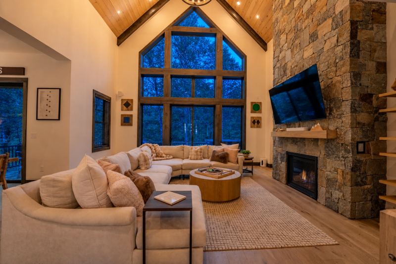 Great room with fireplace and two-story windows