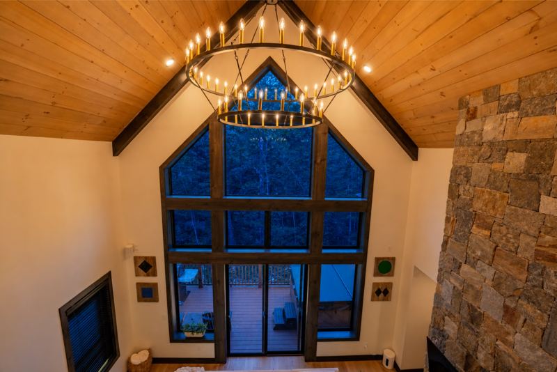 Two-story window wall and chandelier over the great room